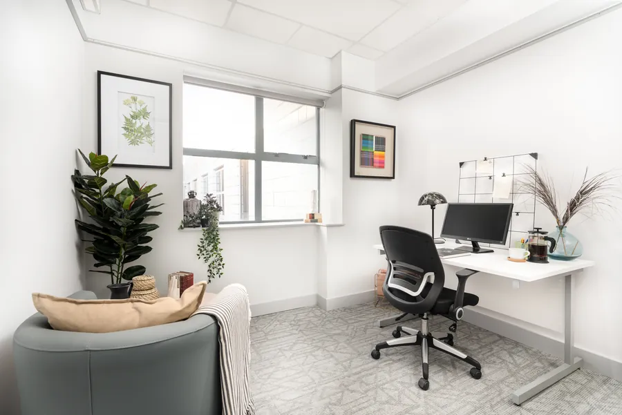 Furnished private office with a desk and breakout seating at the Fern Road offices in Sandyford, Dublin