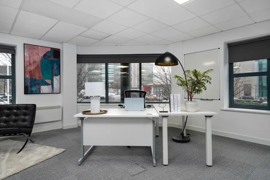 Private single-person office at Workhub Fern Road, Sandyford, Dublin, with a lounge chair and floor lamp